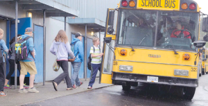 Drivers should always be cautious around school buses, Steve Wallace writes, and must stop when the bus is loading or unloading passengers and the red warning lights are engaged.